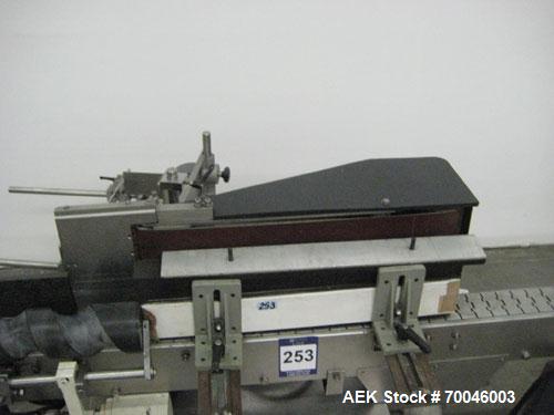 Used Krones Rotina I Wraparound Cold Glue Labeler. Cable of speeds up to 80 bottles per minute on wraparound or 100 bottles per minute on spot labels. Has a label size range: length 2" to 14", width ...