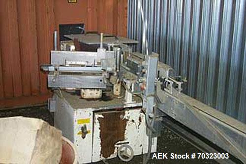 Used Used: Krones Rotina I labeling machine, stainless steel with a painted base, 3 3/4" wide tabletop container chain, good condition, right to left operation.