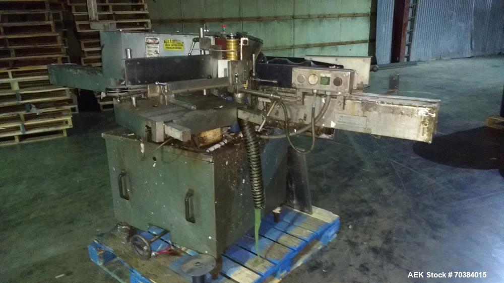 Used Krones Single Head Paper Labeler, Model Rotina. Infeed and discharge conveyor. 220/440 Volt.  Last doing gallon bottles.  Mfg. 1997.