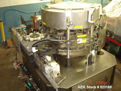 USED: Krones Solomatic 20 station rotary labeler set up for cold glue. Rated for 500 bottles per minute. 3/60/240V. Last used on wine bottles. Built 1987.