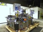 Used Krones Canmatic Rotary Hot Glue Wraparound Labeler. 18 hd Capable of running up to 600 cpm. Container size range: 50-110mm diameter, 50-250mm or 150-350mm height. 18 head unit set on 126mm pitch...