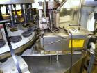 Used Krones Canmatic Rotary Hot Glue Wraparound Labeler. 18 hd Capable of running up to 600 cpm. Container size range: 50-110mm diameter, 50-250mm or 150-350mm height. 18 head unit set on 126mm pitch...