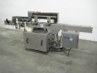Used Krones Rotina I Wraparound Cold Glue Labeler. Cable of speeds up to 80 bottles per minute on wraparound or 100 bottles per minute on spot labels. Has a label size range: length 2