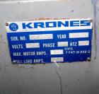 Used Krones Rotina I Wraparound Cold Glue Labeler. Cable of speeds up to 80 bottles per minute on wraparound or 100 bottles per minute on spot labels. Has a label size range: length 2