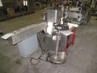 Used Krones Rotina I Wraparound Cold Glue Labeler. Cable of speeds up to 80 bottles per minute on wraparound or 100 bottles per minute on spot labels. Has a label size range: length 2