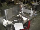 Used Krones Rotina I Wraparound Cold Glue Labeler. Cable of speeds up to 80 bottles per minute on wraparound or 100 bottles per minute on spot labels. Has a label size range: length 2