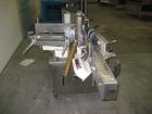 Used Krones Rotina I Wraparound Cold Glue Labeler. Cable of speeds up to 80 bottles per minute on wraparound or 100 bottles per minute on spot labels. Has a label size range: length 2