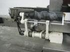 Used Krones Rotina I Wraparound Cold Glue Labeler. Cable of speeds up to 80 bottles per minute on wraparound or 100 bottles per minute on spot labels. Has a label size range: length 2