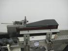 Used Krones Rotina I Wraparound Cold Glue Labeler. Cable of speeds up to 80 bottles per minute on wraparound or 100 bottles per minute on spot labels. Has a label size range: length 2