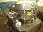 USED: Krones Solomatic 20 station rotary labeler set up for cold glue. Rated for 500 bottles per minute. 3/60/240V. Last used on wine bottles. Built 1987.