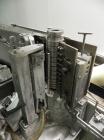 Used New Jersey Machine Mustang II Automatic Glue Labeler capable of speeds up to 250 labels per minute. Has a label size range: length 2-1/2