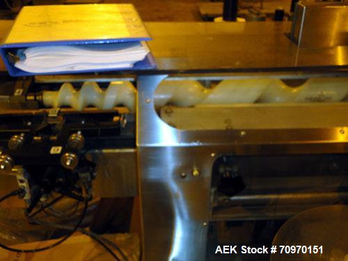Used New Jersey Machine Charger Model NJM/CLI-334 Pressure Sensitive Front / Back / Wraparound Labeler. Capable of speeds up to 400 COM. Container size range: (Height) 1" - 14" or 25.4mm - 355.8mm (D...