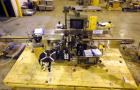 Used New Jersey Machine Charger Model NJM/CLI-334 Pressure Sensitive Front / Back / Wraparound Labeler. Capable of speeds up to 400 COM. Container size range: (Height) 1