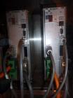 Used New Jersey Machine Charger Model NJM/CLI-334 Pressure Sensitive Front / Back / Wraparound Labeler. Capable of speeds up to 400 COM. Container size range: (Height) 1
