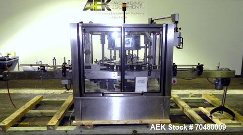 Used P.E. Labellers Six Head Rotary Labeler Model Master M With Dual Model M60 DX 150 Labelling Heads. Capable of Running Front and Back or Wraparound Pressure Sensitive Labels. Six (6) Bottle Plates...