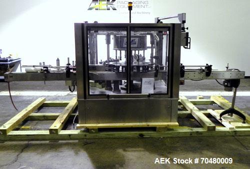 Used P.E. Labellers Six Head Rotary Labeler Model Master M With Dual Model M60 DX 150 Labelling Heads. Capable of Running Front and Back or Wraparound Pressure Sensitive Labels. Six (6) Bottle Plates...