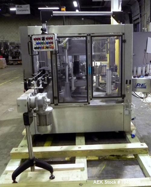 Used P.E. Labellers Six Head Rotary Labeler Model Master M With Dual Model M60 DX 150 Labelling Heads. Capable of Running Front and Back or Wraparound Pressure Sensitive Labels. Six (6) Bottle Plates...