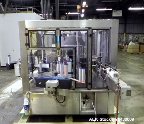 Used P.E. Labellers Six Head Rotary Labeler Model Master M With Dual Model M60 DX 150 Labelling Heads. Capable of Running Front and Back or Wraparound Pressure Sensitive Labels. Six (6) Bottle Plates...