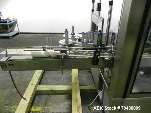 Used P.E. Labellers Six Head Rotary Labeler Model Master M With Dual Model M60 DX 150 Labelling Heads. Capable of Running Front and Back or Wraparound Pressure Sensitive Labels. Six (6) Bottle Plates...