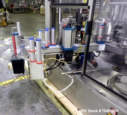 Used P.E. Labellers Six Head Rotary Labeler Model Master M With Dual Model M60 DX 150 Labelling Heads. Capable of Running Front and Back or Wraparound Pressure Sensitive Labels. Six (6) Bottle Plates...