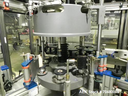 Used P.E. Labellers Six Head Rotary Labeler Model Master M With Dual Model M60 DX 150 Labelling Heads. Capable of Running Front and Back or Wraparound Pressure Sensitive Labels. Six (6) Bottle Plates...