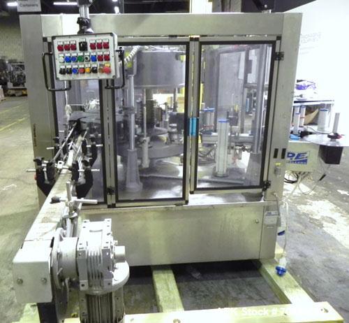 Used P.E. Labellers Six Head Rotary Labeler Model Master M With Dual Model M60 DX 150 Labelling Heads. Capable of Running Front and Back or Wraparound Pressure Sensitive Labels. Six (6) Bottle Plates...