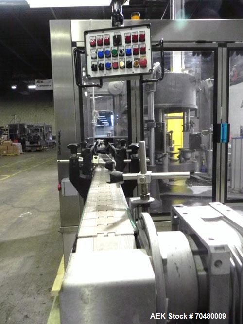 Used P.E. Labellers Six Head Rotary Labeler Model Master M With Dual Model M60 DX 150 Labelling Heads. Capable of Running Front and Back or Wraparound Pressure Sensitive Labels. Six (6) Bottle Plates...