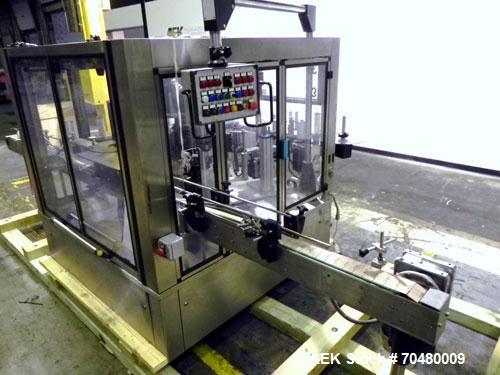 Used P.E. Labellers Six Head Rotary Labeler Model Master M With Dual Model M60 DX 150 Labelling Heads. Capable of Running Front and Back or Wraparound Pressure Sensitive Labels. Six (6) Bottle Plates...