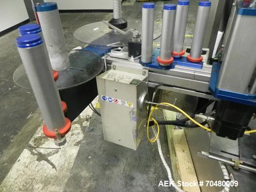 Used P.E. Labellers Six Head Rotary Labeler Model Master M With Dual Model M60 DX 150 Labelling Heads. Capable of Running Front and Back or Wraparound Pressure Sensitive Labels. Six (6) Bottle Plates...