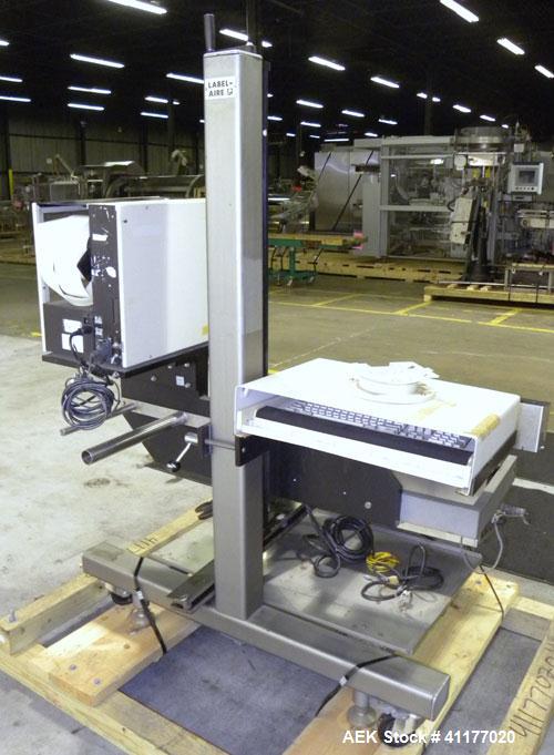 Used Label Aire 2111M/LH Print & Apply Labeler with Zebra print head. Model 2111 is a high speed air-blow labeling machine designed for very accurate label placement. The label is retained by vacuum ...