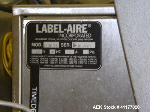 Used Label Aire 2111M/LH Print & Apply Labeler with Zebra print head. Model 2111 is a high speed air-blow labeling machine designed for very accurate label placement. The label is retained by vacuum ...
