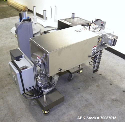 Used New Jersey Machine Print and Apply Labeler, Model 400R. Capable of 50 pieces per minute. Maximum label size 4" wide x 12" long, machine set up to do a corner wrap on a skid or box. This versatil...