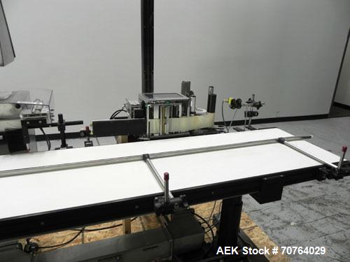 Used Paragon Model PLS-400 Print & Apply Case Labeler. Designed to print barcode and RFID labels. Machine has a 7” Tall label head. Includes automatic belt type case conveyor, integrated on common fr...