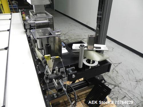 Used Paragon Model PLS-400 Print & Apply Case Labeler. Designed to print barcode and RFID labels. Machine has a 7” Tall label head. Includes automatic belt type case conveyor, integrated on common fr...