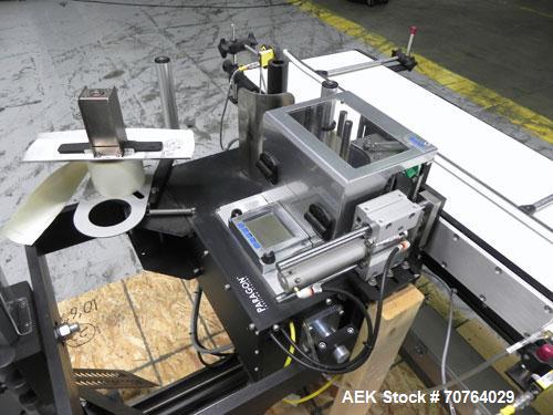 Used Paragon Model PLS-400 Print & Apply Case Labeler. Designed to print barcode and RFID labels. Machine has a 7” Tall label head. Includes automatic belt type case conveyor, integrated on common fr...