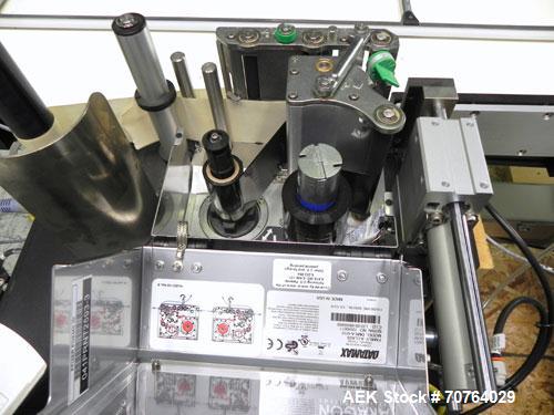 Used Paragon Model PLS-400 Print & Apply Case Labeler. Designed to print barcode and RFID labels. Machine has a 7” Tall label head. Includes automatic belt type case conveyor, integrated on common fr...
