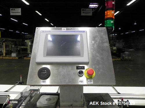 Used Paragon Model PLS-400 Print & Apply Case Labeler. Designed to print barcode and RFID labels. Machine has a 7” Tall label head. Includes automatic belt type case conveyor, integrated on common fr...