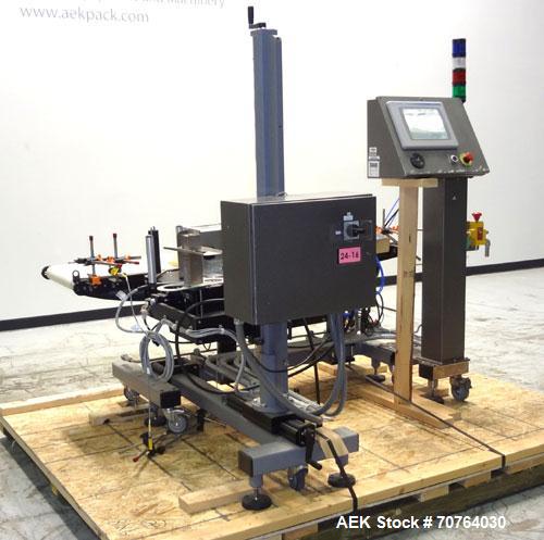 Used Paragon Model PLS-400 Print & Apply Case Labeler. Designed to print barcode and RFID labels using a Datamax DMX-A-4212 Print engine . Machine has a 7” Tall label head. Includes automatic belt ty...