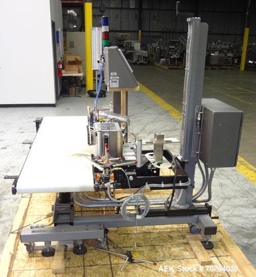 Used Paragon Model PLS-400 Print & Apply Case Labeler. Designed to print barcode and RFID labels using a Datamax DMX-A-4212 Print engine . Machine has a 7” Tall label head. Includes automatic belt ty...