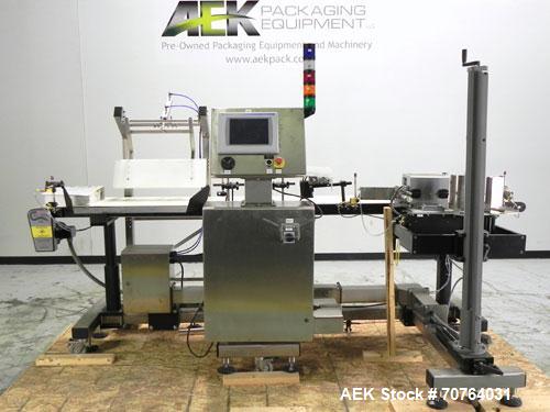 Used Paragon Model PLS-400 Print & Apply Case Labeler. Designed to print barcode and RFID labels. Machine has a 7” Tall label head. Includes automatic belt type case conveyor, integrated on common fr...