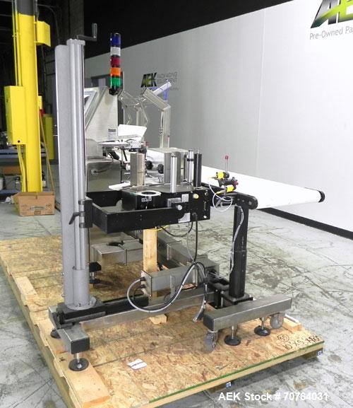 Used Paragon Model PLS-400 Print & Apply Case Labeler. Designed to print barcode and RFID labels. Machine has a 7” Tall label head. Includes automatic belt type case conveyor, integrated on common fr...
