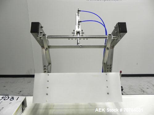 Used Paragon Model PLS-400 Print & Apply Case Labeler. Designed to print barcode and RFID labels. Machine has a 7” Tall label head. Includes automatic belt type case conveyor, integrated on common fr...