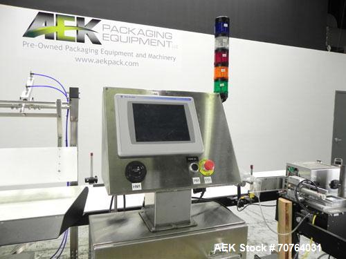Used Paragon Model PLS-400 Print & Apply Case Labeler. Designed to print barcode and RFID labels. Machine has a 7” Tall label head. Includes automatic belt type case conveyor, integrated on common fr...