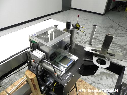 Used Paragon Model PLS-400 Print & Apply Case Labeler. Designed to print barcode and RFID labels. Machine has a 7” Tall label head. Includes automatic belt type case conveyor, integrated on common fr...
