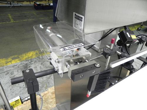 Used Paragon Model PLS-400 Print & Apply Case Labeler. Designed to print barcode and RFID labels. Machine has a 7” Tall label head. Includes automatic belt type case conveyor, integrated on common fr...