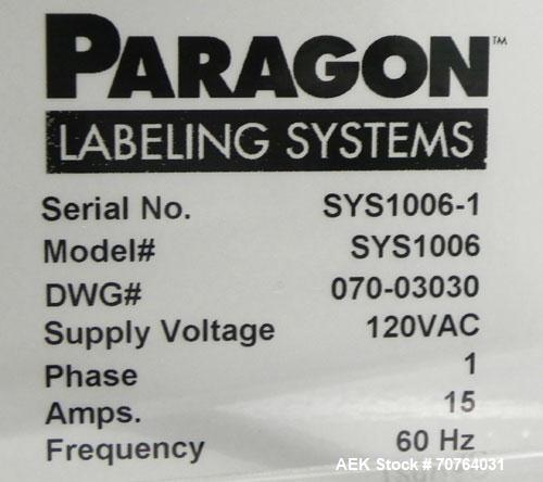 Used Paragon Model PLS-400 Print & Apply Case Labeler. Designed to print barcode and RFID labels. Machine has a 7” Tall label head. Includes automatic belt type case conveyor, integrated on common fr...