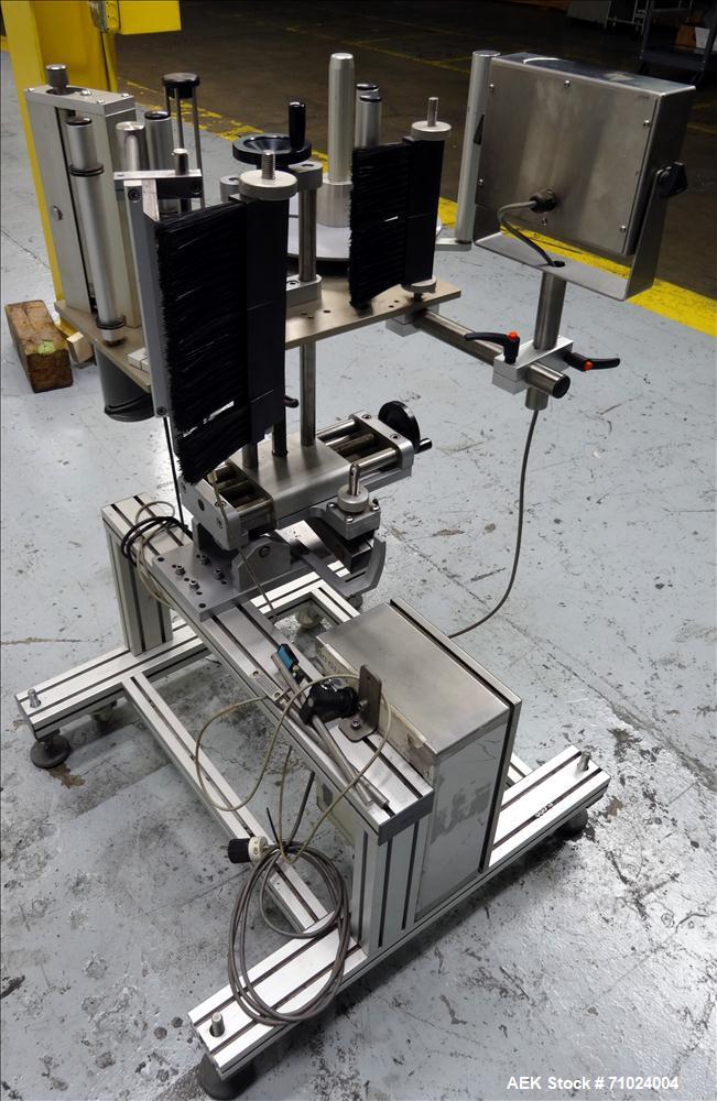 Used Tronics Model S1000 Stand Alone Pressure Sensitive Labeler. Capable of speeds up 1,200" per minute. Has maximum label height of 8.5". Equipped with 9.5" peel plate, tronics hmi, and label sensor...