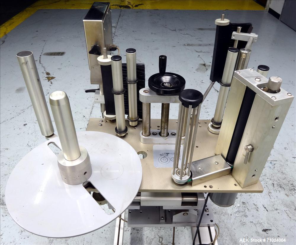 Used Tronics Model S1000 Stand Alone Pressure Sensitive Labeler. Capable of speeds up 1,200" per minute. Has maximum label height of 8.5". Equipped with 9.5" peel plate, tronics hmi, and label sensor...