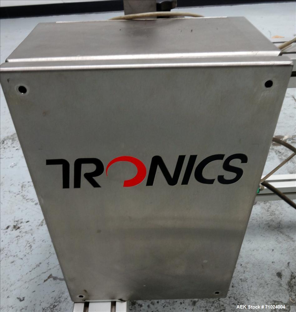 Used Tronics Model S1000 Stand Alone Pressure Sensitive Labeler. Capable of speeds up 1,200" per minute. Has maximum label height of 8.5". Equipped with 9.5" peel plate, tronics hmi, and label sensor...