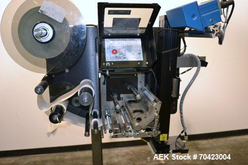 Used Weber Marking Systems Series 5200 Label Printer Applicator Model 5200V2. Label roll size maximum 12" diameter. Includes a Zebra 170 PAX4 print engine. 1/60/115 volt, 5 amp. Mounted on a frame.